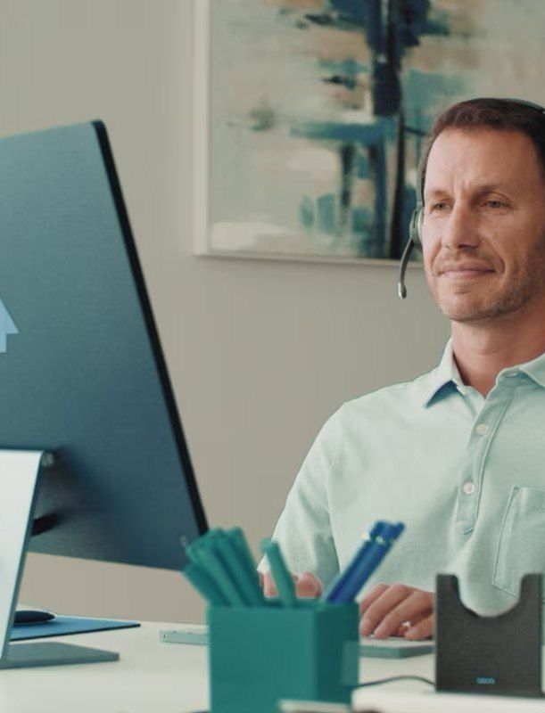 Office worker on a headset call using Webex Smart Audio